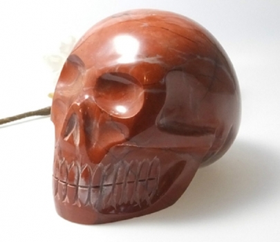 Crystal skull, red jasper 930 grams