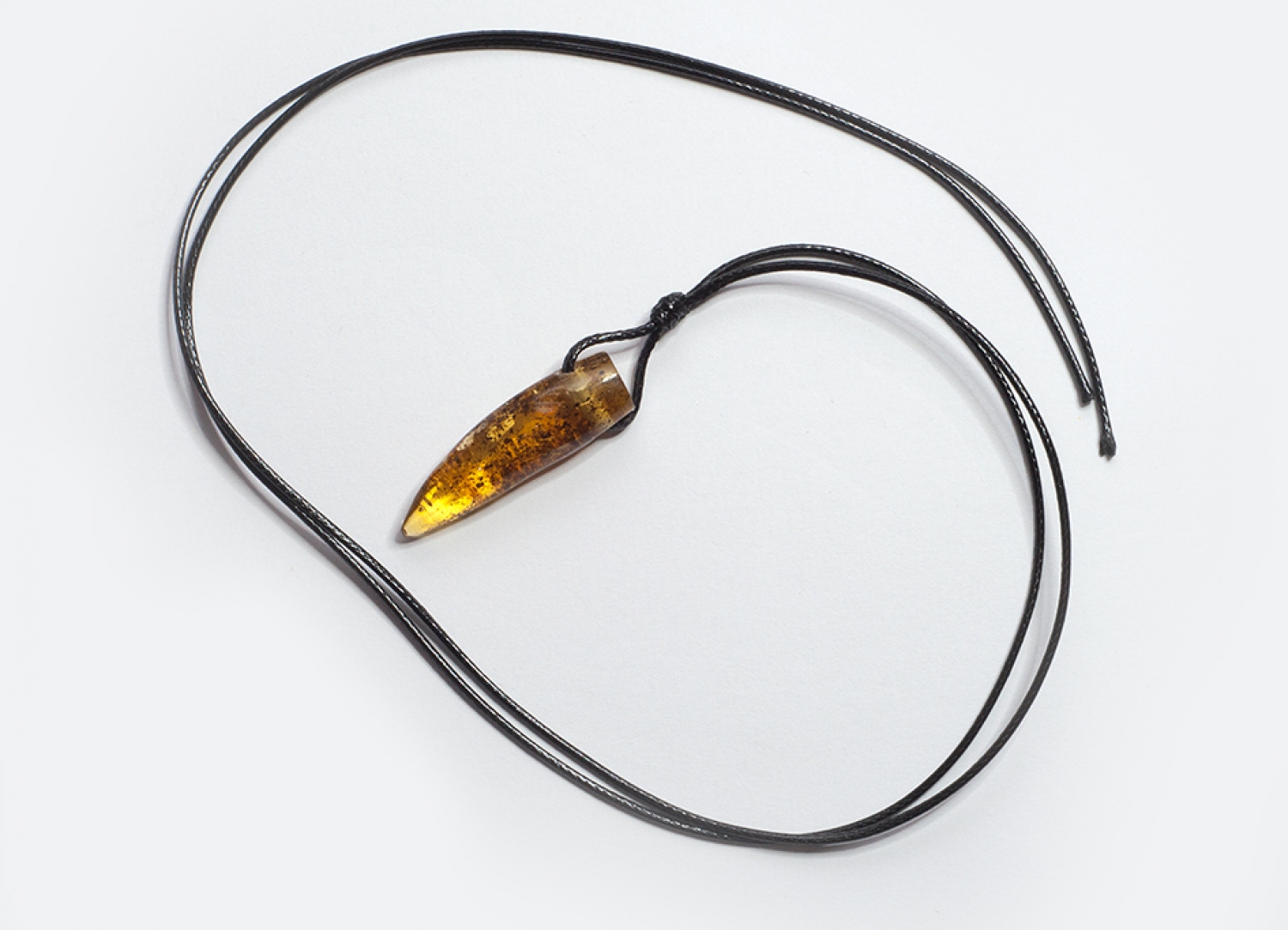 BALTIC amber pendant amulet on leather strap "wolf tusk"